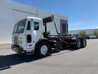 1999 *Peterbilt* *320* *Cab* Over Rolloff Truck Peterbilt 320