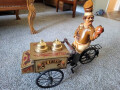 vintage-display-ice-cream-cart-on-a-tricycle-with-vendor-small-0